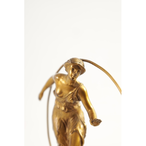 520 - AN ART DECO GILT BRONZE FIGURE GROUP depicitng a 'Hoop Girl' mounted on a stepped onyx base. (18cm h... 