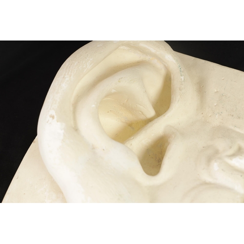 526 - AN OVER-SIZED PLASTERWORK SCULPTURE OF AN EAR (27cm high 19cm wide )