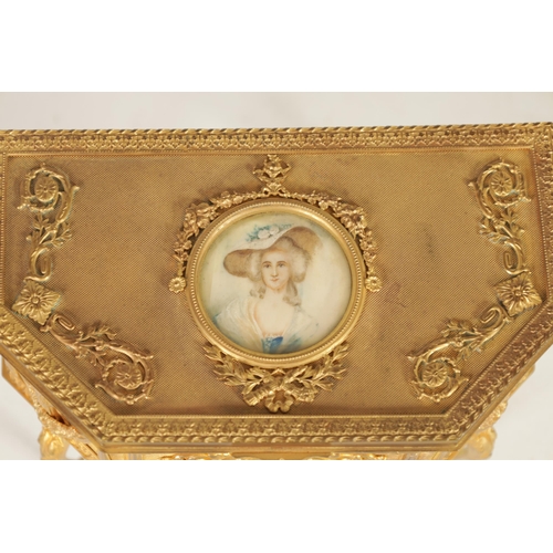 527 - A 19TH CENTURY FRENCH ORMOLU JEWELLERY CASKET of clipped rectangular form on slender cabriole legs w... 