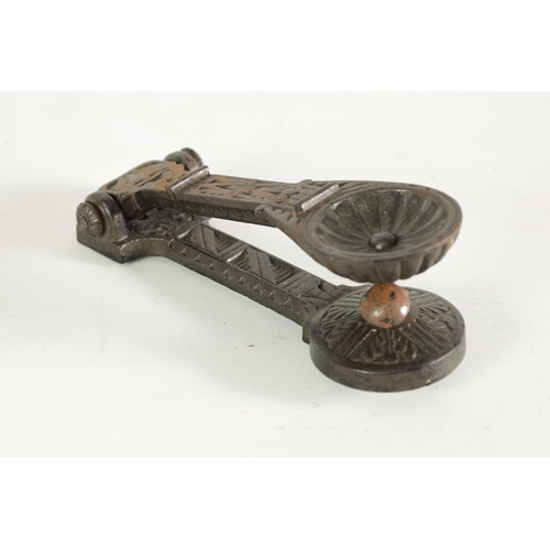 531 - A LATE 19TH CENTURY AESTHETIC PERIOD CAST IRON DOOR KNOCKER with rounded inset end and geometric des... 