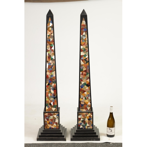 533 - A MASSIVE PAIR OF 20TH CENTURY BLACK SLATE AND SPECIMEN MARBLE OBELISKS of tapering form on stepped ... 