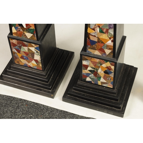 533 - A MASSIVE PAIR OF 20TH CENTURY BLACK SLATE AND SPECIMEN MARBLE OBELISKS of tapering form on stepped ... 