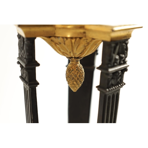 537 - A PAIR OF REGENCY FRENCH EMPIRE BRONZE AND ORMOLU CANDLESTICKS with urn shaped tops above triform su... 