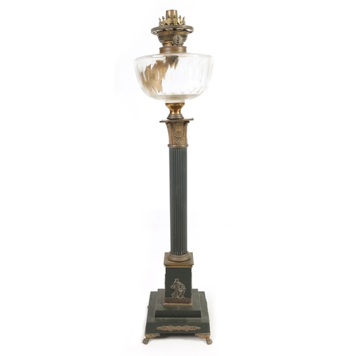 543 - A 19TH CENTURY BRONZE METAL AND GILT EMPIRE STYLE OIL LAMP with clear glass reservoir above a reeded... 