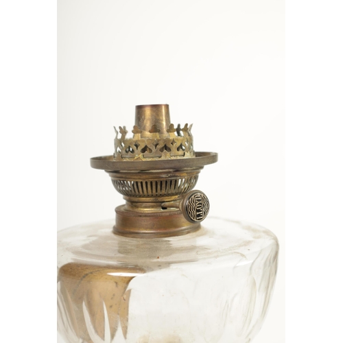 543 - A 19TH CENTURY BRONZE METAL AND GILT EMPIRE STYLE OIL LAMP with clear glass reservoir above a reeded... 