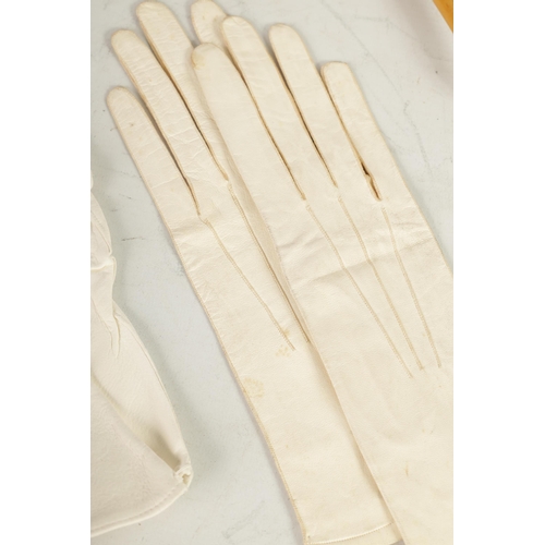 550 - TWO PAIRS OF LATE 19TH CENTURY FINE WHITE LEATHER LADIES GLOVES together with a pair of Mauchline wa... 