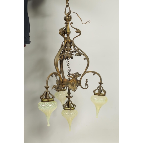 551 - AN ART NOUVEAU BRASS BENSON STYLE FOUR SHADE CEILING LIGHT with scrolling branchwork supporting five... 