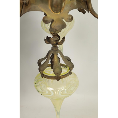 551 - AN ART NOUVEAU BRASS BENSON STYLE FOUR SHADE CEILING LIGHT with scrolling branchwork supporting five... 