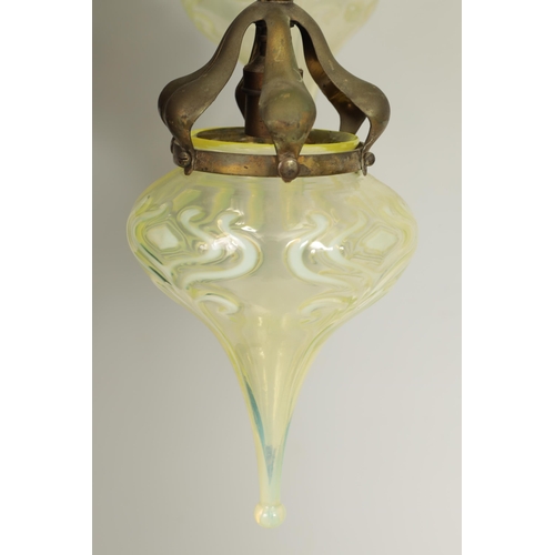 551 - AN ART NOUVEAU BRASS BENSON STYLE FOUR SHADE CEILING LIGHT with scrolling branchwork supporting five... 