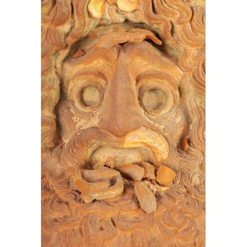 552 - A 19TH CENTURY TERRACOTTA AND PLASTERWORK MASK depicting a bearded man (39cm wide 39cm high )