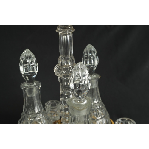 555 - A LATE 19TH CENTURY FRENCH ORMOLU AND CUT GLASS DECANTER SET with three bulbous cut glass decanters ... 