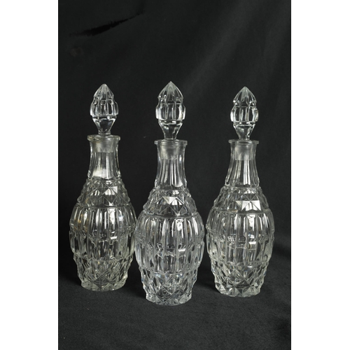 555 - A LATE 19TH CENTURY FRENCH ORMOLU AND CUT GLASS DECANTER SET with three bulbous cut glass decanters ... 