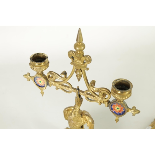 556 - A PAIR OF LATE 19TH CENTURY BRASS AESTHETIC PERIOD DOUBLE BRANCH CANDELABRA set with porcelain panel... 