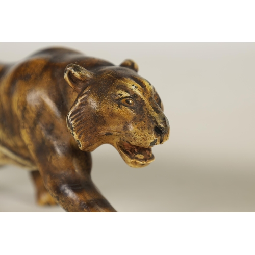 557 - A LATE 19TH-CENTURY BERGMAN-STYLE COLD-PAINTED BRONZE SCULPTURE OF A PROWLING TIGER (21cm long)