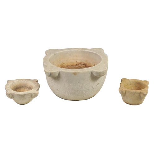 560 - THREE 19TH CENTURY CARVED CARRERA MARBLE MORTARS comprising one large and two similar smaller exampl... 