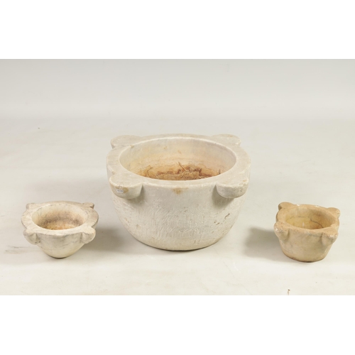 560 - THREE 19TH CENTURY CARVED CARRERA MARBLE MORTARS comprising one large and two similar smaller exampl... 