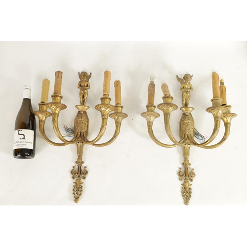 567 - A PAIR OF 19TH CENTURY STYLE FRENCH FOUR BRANCH CAST BRASS WALL LIGHTS with empire style mask head a... 