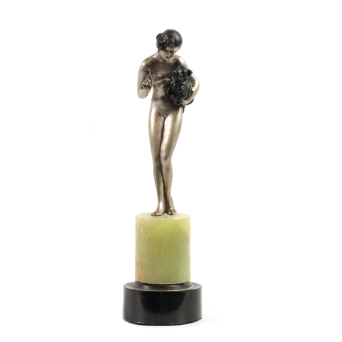 574 - JOSEF LORENZL (1892 - 1950) AN ART DECO COLD PAINTED BRONZE FIGURE depicting a nude lady holding a d... 