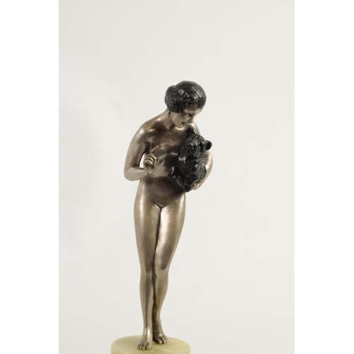 574 - JOSEF LORENZL (1892 - 1950) AN ART DECO COLD PAINTED BRONZE FIGURE depicting a nude lady holding a d... 