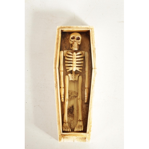 578 - A 19TH CENTURY BONE MINIATURE COFFIN with articulated skeleton to the interior; the lid with applied... 