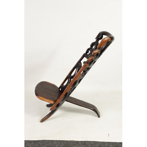 584 - AN AFRICAN TRIBAL HARDWOOD PALAVER CHAIR with figural pierced back (89cm high)