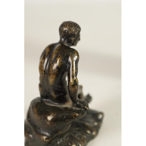 585 - A 19TH CENTURY FRENCH PATINATED BRONZE SCULPTURE OF MERCURY modelled seated on a rocky outcrop. (11c... 