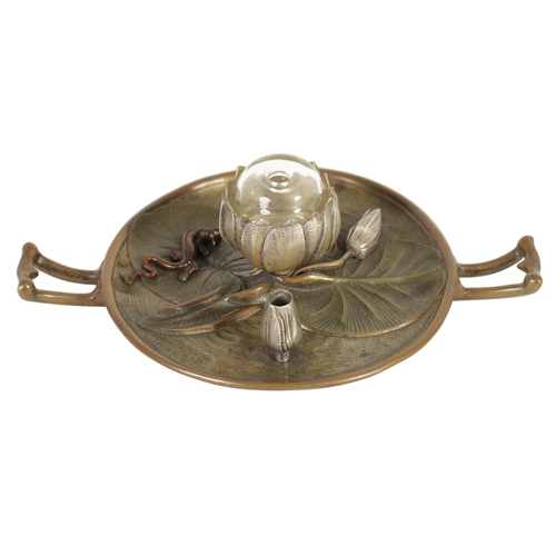 588 - A LATE 19TH CENURY COLD PAINTED BRONZE INKWELL modelled as a Lilly pad with silvered petals and copp... 