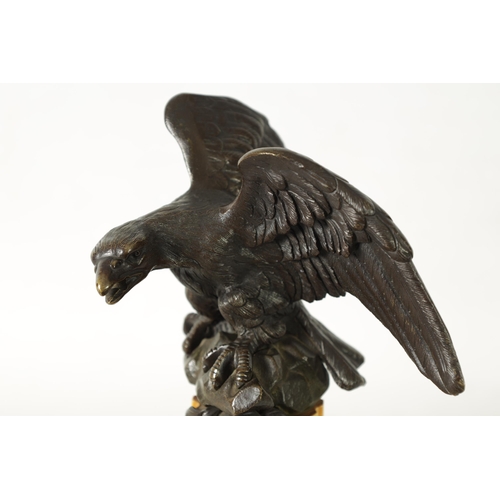 590 - A LARGE 19TH CENTURY BRONZE AND SIENNA MARBLE WATCH STAND formed as an eagle perched on a reeded and... 