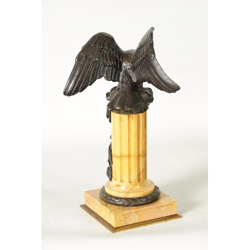 590 - A LARGE 19TH CENTURY BRONZE AND SIENNA MARBLE WATCH STAND formed as an eagle perched on a reeded and... 