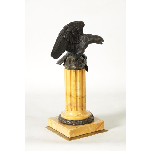 590 - A LARGE 19TH CENTURY BRONZE AND SIENNA MARBLE WATCH STAND formed as an eagle perched on a reeded and... 