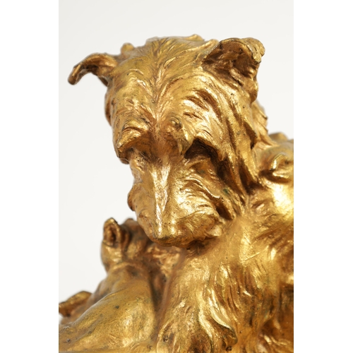 591 - CHARLES PAILLET (1871 - 1937). A LATE 19TH CENTURY GILT BRONZE SCULPTURE OF A RECUMBENT DOG WITH CAT... 