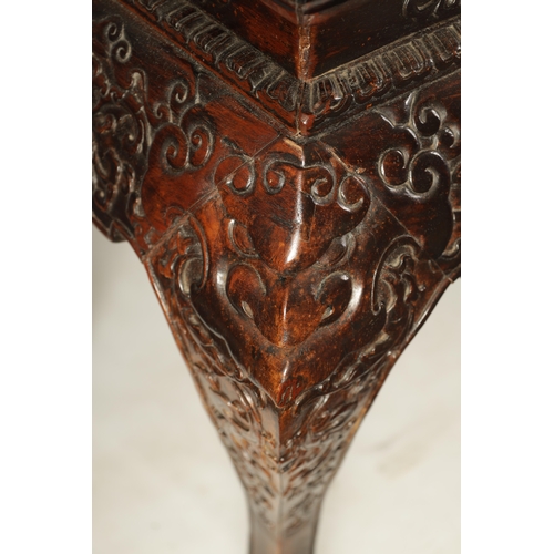 183 - A 20TH CENTURY CHINESE HARDWOOD ALTAR TABLE with inset panelled top above a cushion moulded relief c... 