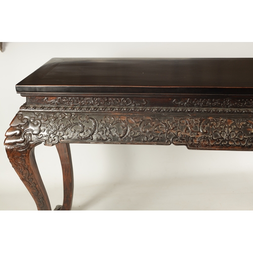 183 - A 20TH CENTURY CHINESE HARDWOOD ALTAR TABLE with inset panelled top above a cushion moulded relief c... 