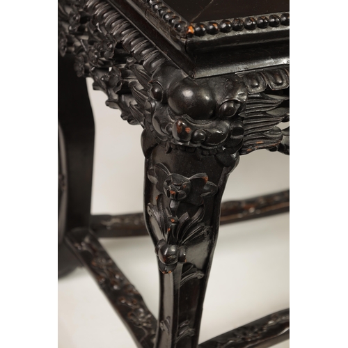 229 - A 19TH CENTURY CHINESE EBONISED HARDWOOD ALTAR TABLE with panelled top above a leaf carved pierced f... 