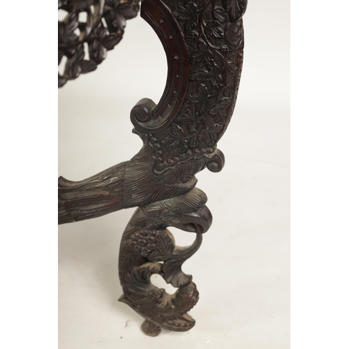 255 - A 19TH CENTURY ANGLO-INDIAN CARVED HARDWOOD DEMI LUNE SERVING TABLE with profusely carved and pierce... 