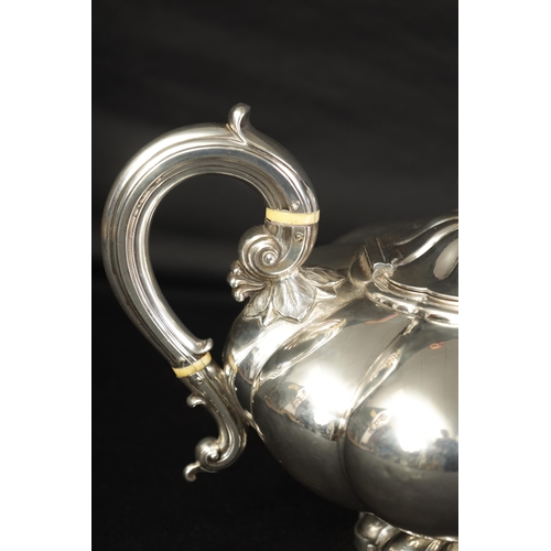 324 - A GEORGE IV FOOTED MELON SHAPED SILVER TEA POT the gadrooned body bearing an engraved lion motif wit... 