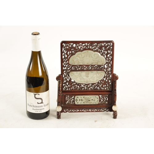117 - A 19TH CENTURY CHINESE CARVED JADE AND HARDWOOD TABLE SCREEN the pierced fret cut frame with leafwor... 