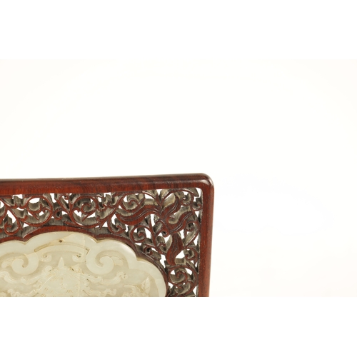 117 - A 19TH CENTURY CHINESE CARVED JADE AND HARDWOOD TABLE SCREEN the pierced fret cut frame with leafwor... 