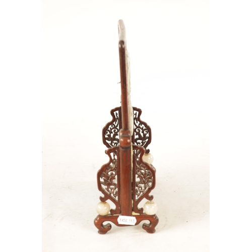 117 - A 19TH CENTURY CHINESE CARVED JADE AND HARDWOOD TABLE SCREEN the pierced fret cut frame with leafwor... 