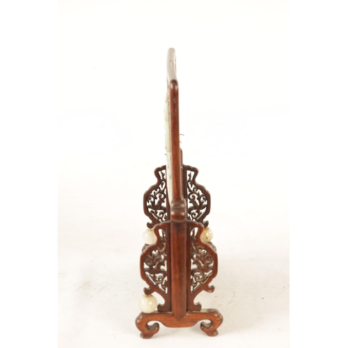 117 - A 19TH CENTURY CHINESE CARVED JADE AND HARDWOOD TABLE SCREEN the pierced fret cut frame with leafwor... 