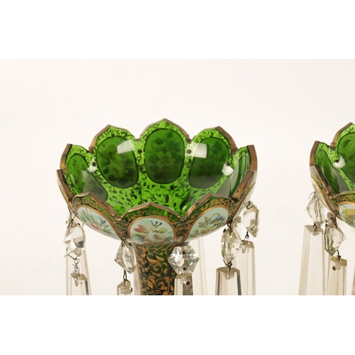 12 - A GOOD PAIR OF 19TH-CENTURY BOHEMIAN WHITE OVERLAY AND GILT-DECORATED GREEN GLASS LUSTRES the cut se... 