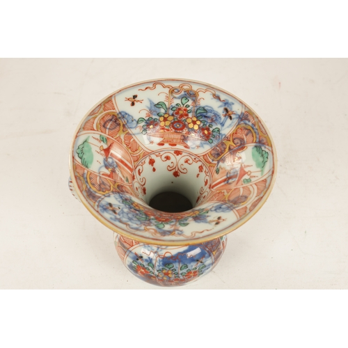 127 - A LATE 19TH CENTURY CHINESE IMARI SPITTOON of squat bulbous form with shaped handle and flared neck,... 