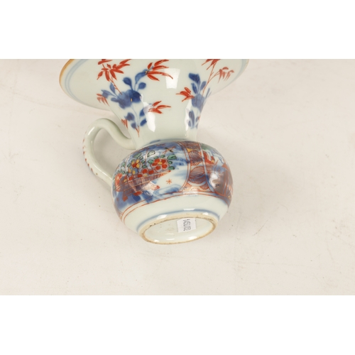 127 - A LATE 19TH CENTURY CHINESE IMARI SPITTOON of squat bulbous form with shaped handle and flared neck,... 