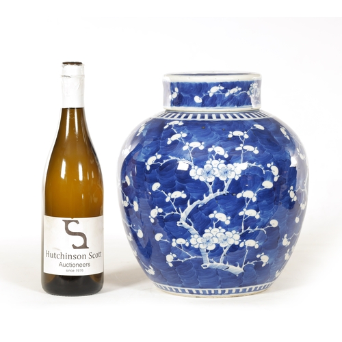 130 - A 19TH CENTURY CHINESE BLUE AND WHITE PORCELAIN GINGER JAR AND COVER decorated with Prunus Blossom -... 