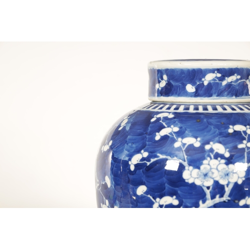 130 - A 19TH CENTURY CHINESE BLUE AND WHITE PORCELAIN GINGER JAR AND COVER decorated with Prunus Blossom -... 