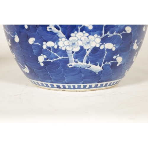 130 - A 19TH CENTURY CHINESE BLUE AND WHITE PORCELAIN GINGER JAR AND COVER decorated with Prunus Blossom -... 