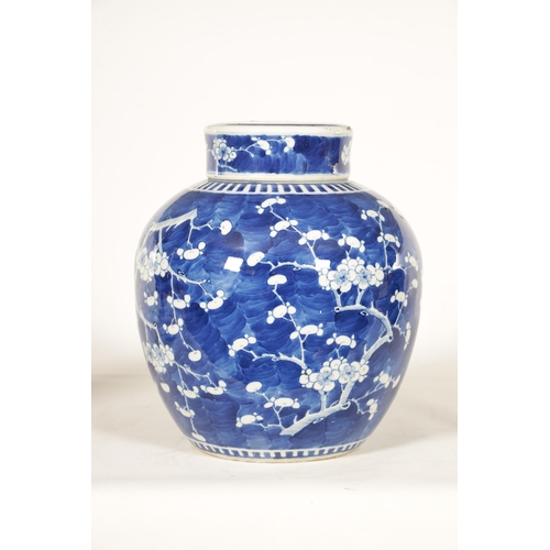 130 - A 19TH CENTURY CHINESE BLUE AND WHITE PORCELAIN GINGER JAR AND COVER decorated with Prunus Blossom -... 