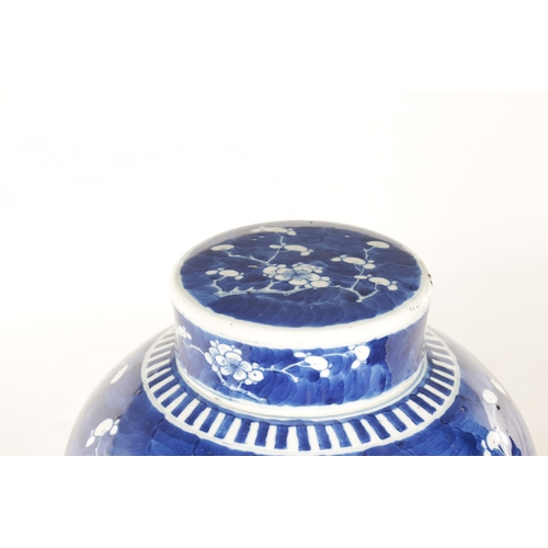 130 - A 19TH CENTURY CHINESE BLUE AND WHITE PORCELAIN GINGER JAR AND COVER decorated with Prunus Blossom -... 