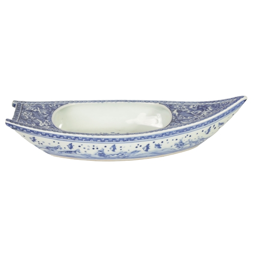 140 - A 19TH CENTURY CHINESE BLUE AND WHITE PORCELAIN BOAT-SHAPED DISH the top decorated with carp amongst... 