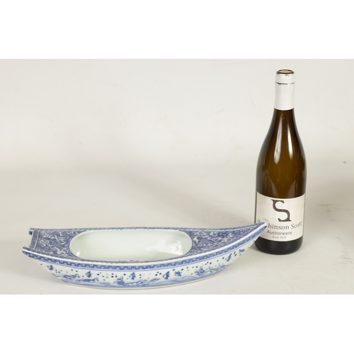140 - A 19TH CENTURY CHINESE BLUE AND WHITE PORCELAIN BOAT-SHAPED DISH the top decorated with carp amongst... 